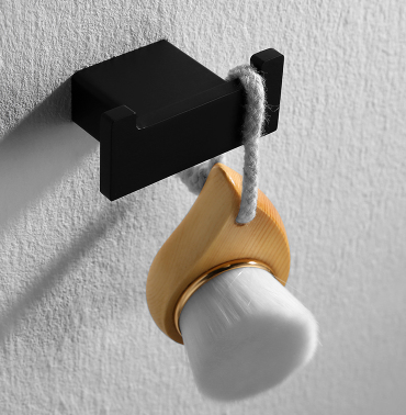 sleek rope hook holding a brush